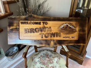wood   sign  brown town 
